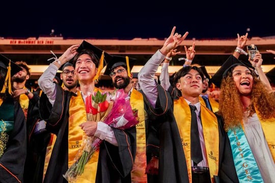 University of Texas students celebrate during commencement in Austin in May